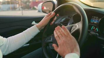 Man driving in innovative automated car using lane holding function. Robotic computer turning wheel in auto steering mode. Concept of modern technology in the automotive industry video