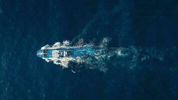 Top view of a fishing boat sailing in the Atlantic Ocean video