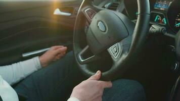 Man driving in innovative automated car using lane holding function. Robotic computer turning wheel in auto steering mode. Concept of modern technology in the automotive industry video
