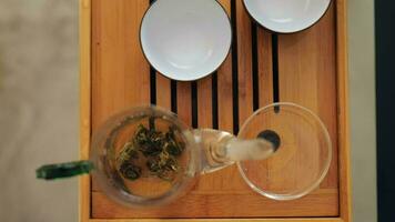 elite Chinese white tea is brewed in glassware video