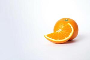 Fresh whole and sliced oranges isolated on white background with copy space. photo