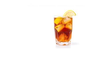 a glass of iced lemon tea with a slice of lemon isolated on white background with copy space. photo