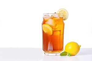 a glass of iced lemon tea with a slice of lemon isolated on white background with copy space. photo