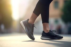 Legs view of a person walking on the road wearing sports shoes. photo