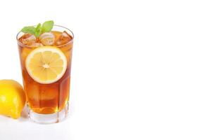 a glass of iced lemon tea with a slice of lemon isolated on white background with copy space. photo