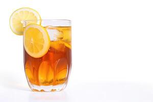 a glass of iced lemon tea with a slice of lemon isolated on white background with copy space. photo