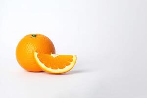 Fresh whole and sliced oranges isolated on white background with copy space. photo