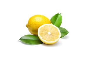 Whole and slice lemon with leaves isolated on white background. photo