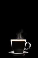 Close up a cup of a black hot coffee with smoke on black background with copy space. photo