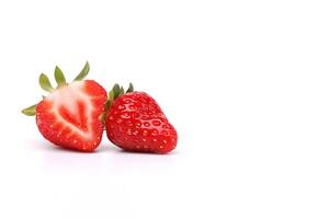 Fresh whole and sliced strawberries isolated on white background with copy space. photo