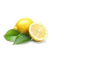 Whole and slice lemon with leaves isolated on white background with copy space. photo