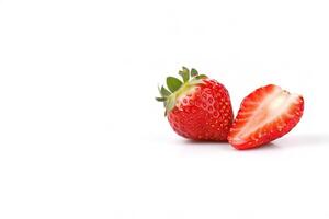 Fresh whole and sliced strawberries isolated on white background with copy space. photo