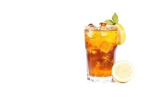 a glass of iced lemon tea with a slice of lemon isolated on white background with copy space. photo