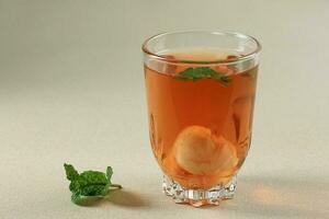 Lychee Tea, Sweet Tea with Canned Litchi and Mint Leaf. photo