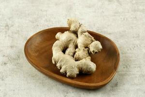 Jahe Ginger Root on Wooden Plate photo