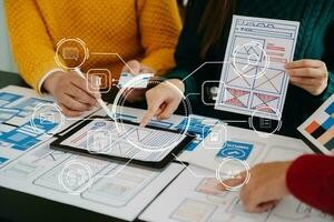 UX graphic designer planning application process development prototype wireframe for web smart phone. Creative digital development agency. photo