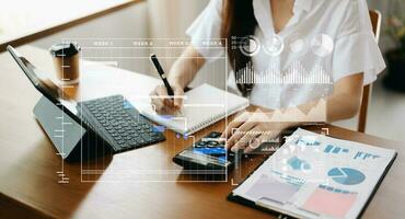 Businessman hand Project manager working and update tasks and Gantt chart scheduling virtual diagram.with smart phone, tablet and laptop in office. photo