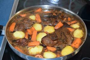 Bacon in Dark Sauce with Carrots and Potatoes photo