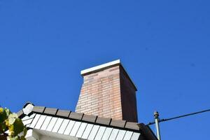 Brick Chimney on a house photo