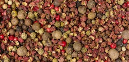 Various mixture of peppers, red, black and allspice. Seasoning for cooking photo