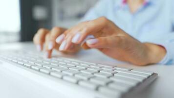 Female hands typing on a computer keyboard. Concept of remote work. Home Office video