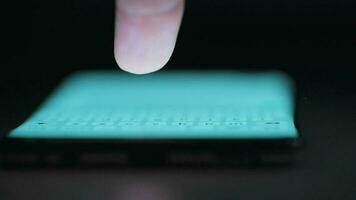 Hand using smartphone for surfing internet close-up at night video