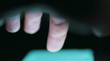 Hand using smartphone for surfing internet close-up at night video