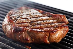 Steak on the grill white background. photo