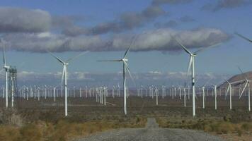 Wind turbines turn in the Tehachapi Pass Wind Farm, California. video