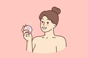 Woman with bath bomb in hands smiles as she prepares to take bath with aromatic substances. Happy girl with bare shoulders demonstrates bomb for comfortable water treatments or SPA vector