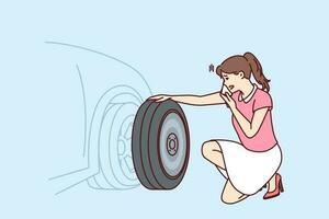 Woman looks at punctured car tire trying to call for help to change tire or haul automobile to garage. Girl near car parked on roadside needs emergency help for concept of breakdown on road vector