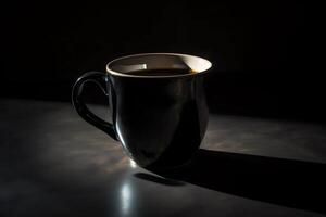 A black coffee mug is shown on a dark background with a shadow on the ground and a black background with a black coffee mug on it. photo