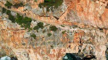 Aerial drone view of a beautiful sunny coastal area. Holidays and vacation time. Rocks and cliffs next to the sea. Summertime. Relax concept. Beach. video