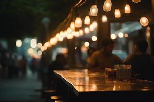 Bokeh background of street bar beer restaurant outdoor in asia people sit chill out and hang out dinner and listen to music together in avenue happy life work hard play hard. photo