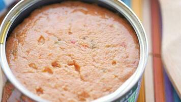 canned tuna on wooden table , video