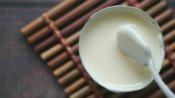 condensed milk in a bowl close up video