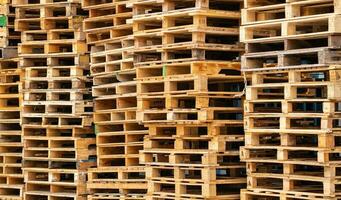 Stack of wooden pallet. Industrial wood pallet at factory warehouse. Cargo and shipping concept. Sustainability of supply chains. Eco-friendly nature and sustainable properties. Renewable wood pallet. photo