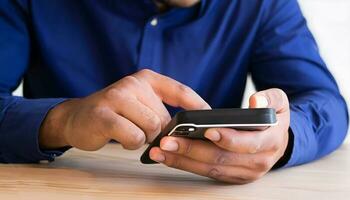 Close up of a man using mobile. photo