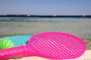 Beach tennis set on sand, summer sport activity photo