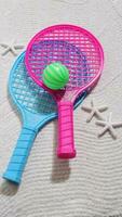 Beach tennis set on sand, summer sport activity photo