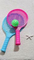 Beach tennis set on sand, summer sport activity photo