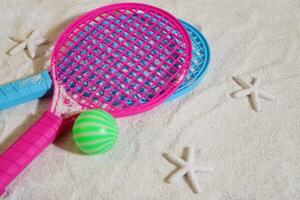 Beach tennis set on sand, summer sport activity photo