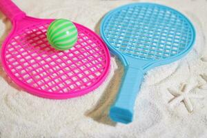 Beach tennis set on sand, summer sport activity photo