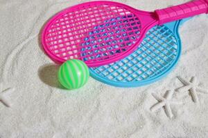 Beach tennis set on sand, summer sport activity photo