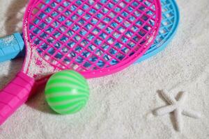 Beach tennis set on sand, summer sport activity photo