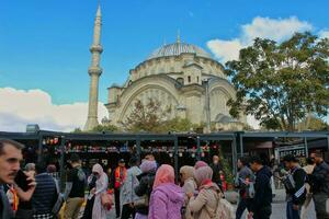 Istanbul, Turkey - February 2021. Tourists visit The Blue Mosque in Istanbul which is the largest mosque in Istanbul. Sultan Ahmed Mosque in Istanbul. photo