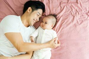 image of asian father and son at home photo