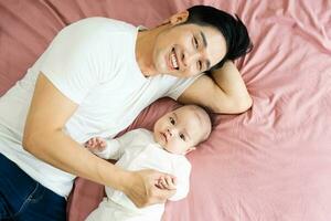 image of asian father and son at home photo