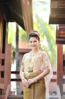 Beautiful Thai girl in Thai traditional costume photo