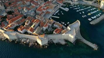 Aerial drone view of the Old historic city of Dubrovnik in Croatia, UNESCO World Heritage site. Famous tourist attraction in the Adriatic Sea. Fortified old city. Tourism and travel to Croatia. video